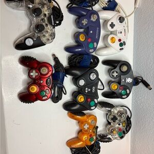 Assorted Wired Game Controllers - Black, Red, Purple, White, Orange, untested